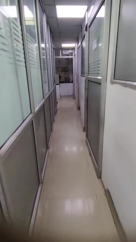 Partitioned laboratory corridor connecting separate work areas